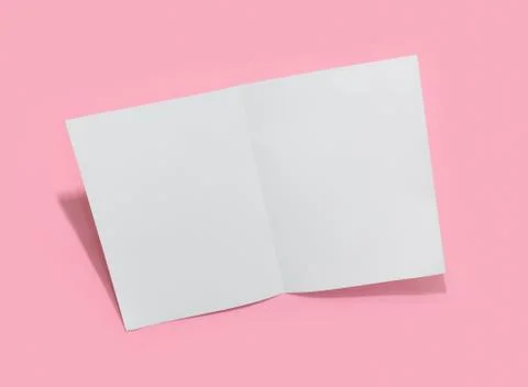 Empty white paper sheet for text on pink background. Stock Photos