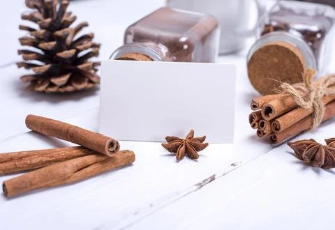 Empty white paper tag and cinnamon sticks Stock Photos