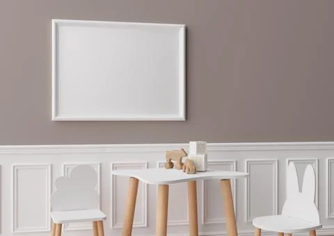Empty white picture frame on brown wall in modern child room. Mock up interio Foto stock
