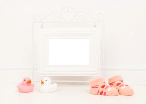 Empty white picture frame with space for text or wishes in a white living roo Stock Photos