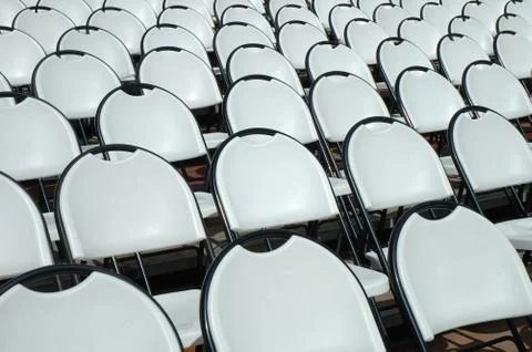 Empty white plastic chairs in open air cinema Stock-Fotos