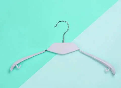 Empty white plastic clothes hanger on colorful background Foto stock