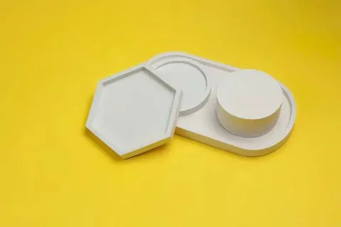Empty white plastic container with lid on yellow background Foto stock