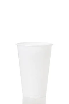 Empty white plastic cup isolated on white background shoot in studio. Stock Photos