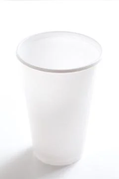 Empty white plastic cup isolated on white background shoot in studio. Stock Photos