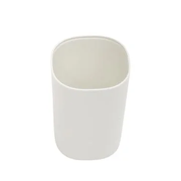 Empty white plastic cup isolated on a white background. Minimalist bathroom.. Stock Photos