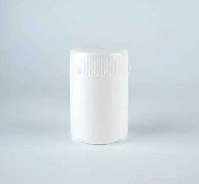 Empty white plastic jar with a lid for medicines Stock Photos