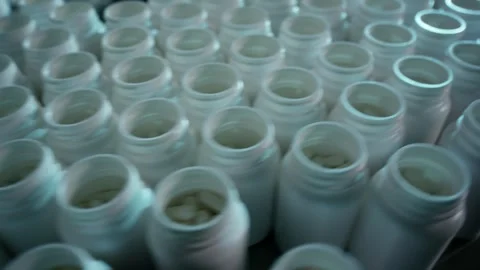 Empty White Plastic Jars Standing In Dense Rows, Packaging Factory, Macro Shot Stock Footage 341331190