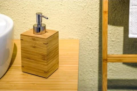 Empty white plastic pump bottle used for shampoo or soap. Interior design of the Stock Photos