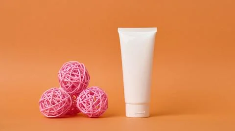 Empty white plastic tubes for cosmetics. Packaging for cream, gel, serum, adv Stock Photos