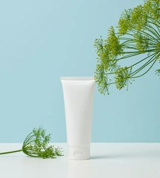 Empty white plastic tubes for cosmetics. Packaging for cream, gel, serum, adv Stock Photos