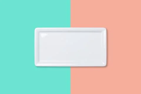 Empty white plate on bicolored background Stock Photos