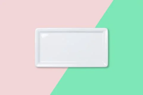 Empty white plate on bicolored background Stock Photos