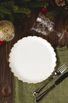 Empty white plate mock up at served Christmas table among decorations. Top view Stock Photos