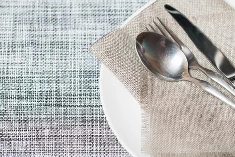 Empty white plate spoon, fork, knife Stock Photos