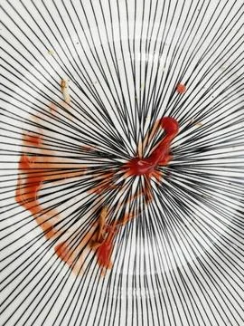 Empty white plate , with tomato ketchup , placed on the wooden table Stock Photos