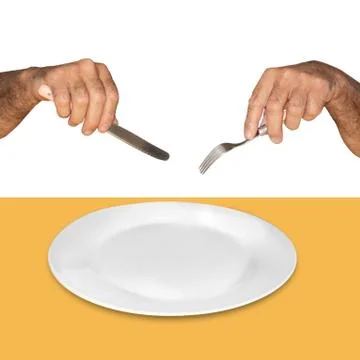 Empty white plate on a yellow background and hands with a knife and fork are  Stock Photos