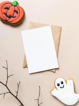 Empty white postcard and craft envelope and Halloween gingerbread cookies - J Stock Photos