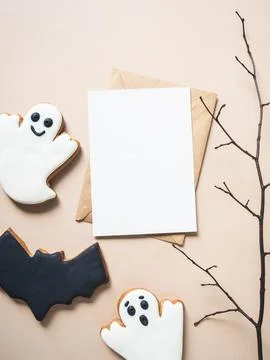 Empty white postcard and craft envelope and Halloween gingerbread cookies - b Stock Photos