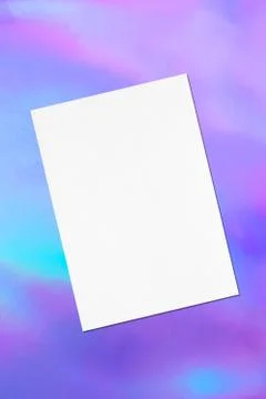 Empty white poster mockup lying diagonally on holographic background Stock Photos
