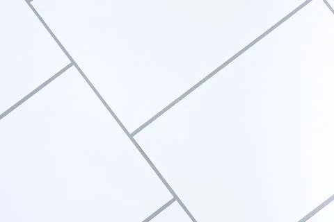 Empty white rectangle poster mockups on a neutral gray background. Stock Photos