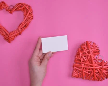 Empty white rectangular business card in a female hand 写真素材