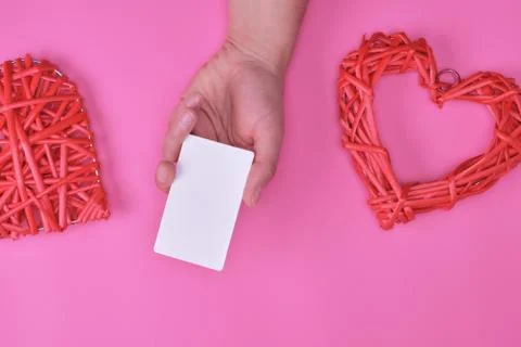Empty white rectangular business card in a female hand 스톡 사진