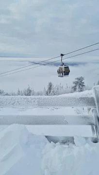 Empty white red closed ski lift cabin no people and white dramatic snowy Stock Photos