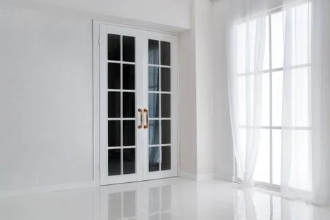 Empty white room with big window and glass french door Stock Photos