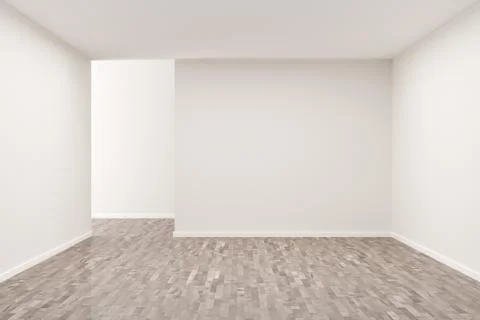 Empty white room with blank walls and brown hardwood floor - presentation or  Ilustración de archivo