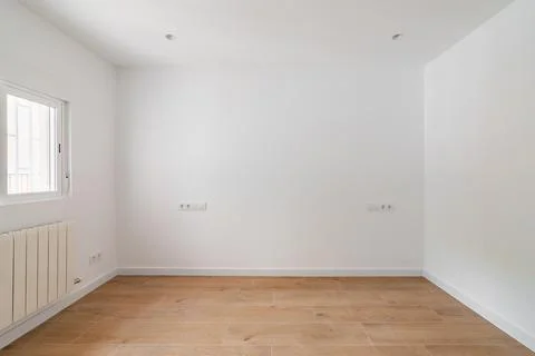 Empty white room with window and natural light. Interior of the freshly renov Stock Photos
