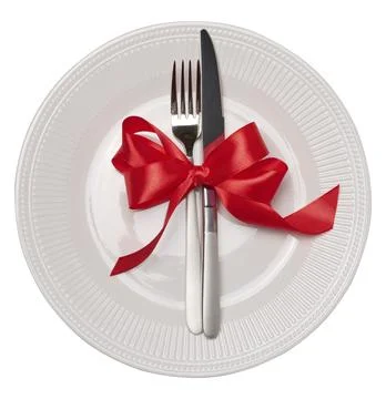 Empty white round plate, fork and knife on isolated background, top view Stock Photos