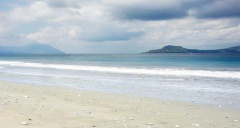 Empty white sand beach and clear blue ocean waves at Bajawa Ruting, Flores. Stock Photos