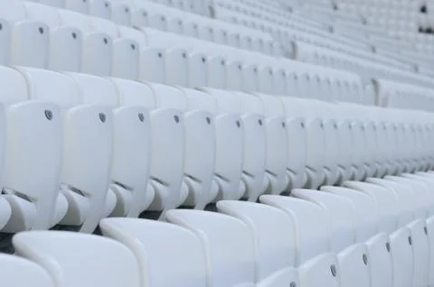 Empty white seats at the stadium during isolation period Stock Photos