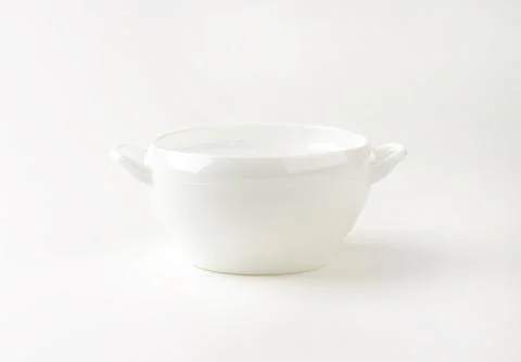 Empty white soup crock with two handles Stock Photos