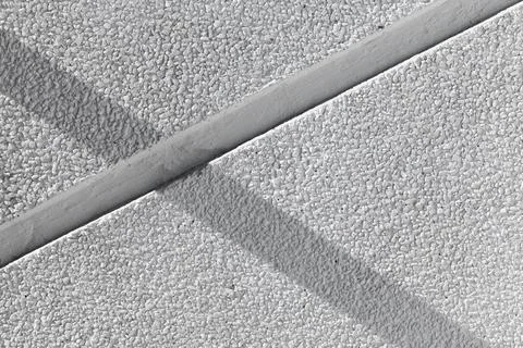 Empty white stone wall with shadow. Abstract background photo Stock Photos