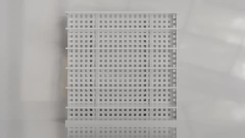 An empty white store shelving unit with shelves on a light background for p.. Stock Illustration