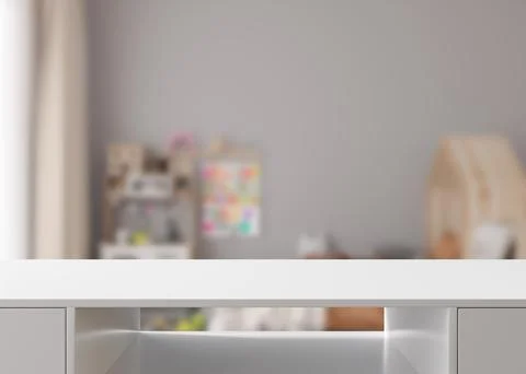 Empty white table top and blurred kids room interior on the background. Copy イラスト素材