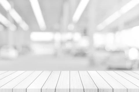 Empty white table top, counter over blur white bokeh light background. wooden 库存插图