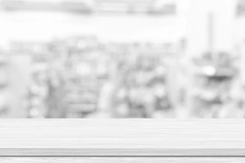 Empty white table top, counter over blur white bokeh light background. Empty  Stock Photos