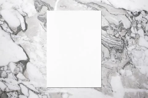 Empty white vertical rectangle poster mockup on grey marble background Stock Photos