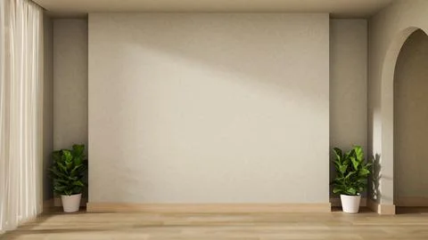 Empty white wall and pot plant on wooden parquet floor with sunlight throug.. Ilustración de archivo