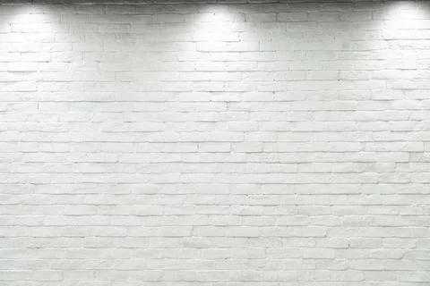 Empty white wall with halogen with 3 lamps. Stock Photos