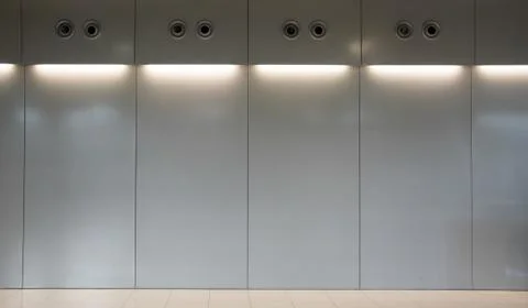 Empty white wall with halogen lamps Stock Photos