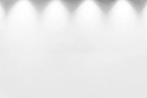 Empty white wall with halogen with lamps. Stock Photos