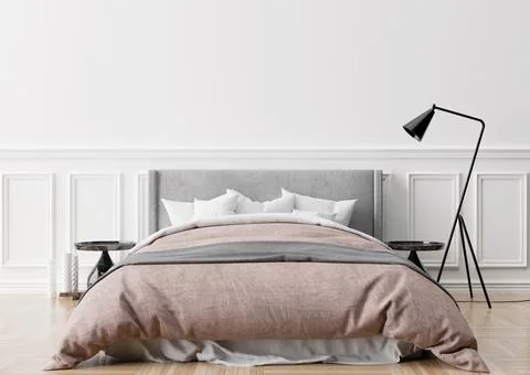 Empty white wall in modern and cozy bedroom. Mock up interior in classic styl Stock Photos