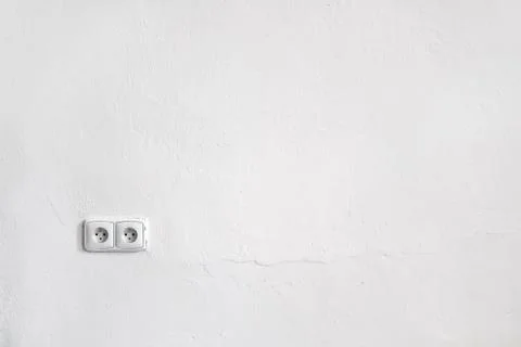 Empty white wall space for text images with two power sockets Stock Photos