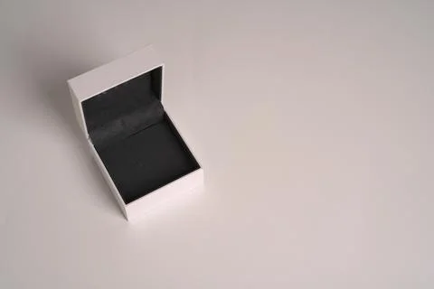 An empty white wedding ring box on a white background. Space for the text Stock Photos