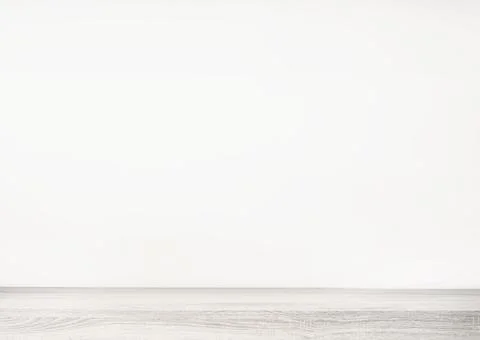 Empty white wood table top and blur wall. Wall Texture Background. Building Stock Photos