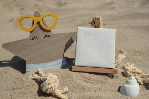 Empty whiteboard frame with copy space for your text or design displays on sandy Stock Photos